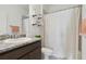 Bathroom featuring granite counters, and a shower-tub combo with patterned shower curtain at 11912 Richmond Trl, Parrish, FL 34219