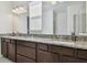 Beautiful bathroom with granite counters, double sinks and modern fixtures at 11912 Richmond Trl, Parrish, FL 34219