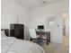 Bedroom with a bed, desk, and a dresser offers a comfortable space at 11912 Richmond Trl, Parrish, FL 34219