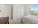 Bedroom featuring a bed, dresser, and a window with natural light at 11912 Richmond Trl, Parrish, FL 34219