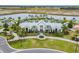 Aerial view of neighborhood entrance with amenities, landscaping, and walking trails at 11912 Richmond Trl, Parrish, FL 34219