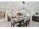 Stylish dining area adjacent to the kitchen features a large table perfect for Gathering meals and gatherings at 11912 Richmond Trl, Parrish, FL 34219