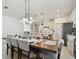 Open-concept design: dining area seamlessly connects to a modern kitchen and cozy living space at 11912 Richmond Trl, Parrish, FL 34219