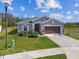 Attractive single-story home with manicured lawn and attached two-car garage at 11912 Richmond Trl, Parrish, FL 34219