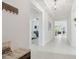 Bright, open foyer with white tile floors leads to bedroom and living areas at 11912 Richmond Trl, Parrish, FL 34219