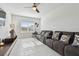Inviting living room features a comfortable sofa, bright window, and a sleek entertainment center at 11912 Richmond Trl, Parrish, FL 34219