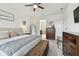 Spacious main bedroom with ensuite bathroom, king bed, chest and natural light at 11912 Richmond Trl, Parrish, FL 34219