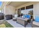 A spacious covered patio showcases comfortable seating and outdoor grilling at 11912 Richmond Trl, Parrish, FL 34219