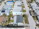 An aerial view captures this property on stilts with easy beach access at 120 148Th E Ave, Madeira Beach, FL 33708
