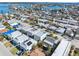 Aerial view of a residential neighborhood with waterfront properties and beautiful blue water access at 120 148Th E Ave, Madeira Beach, FL 33708