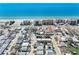 Aerial view of property close to the beach, showcasing proximity to the water and local businesses at 120 148Th E Ave, Madeira Beach, FL 33708