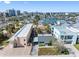 Aerial view of a quaint coastal community with canal access and vibrant architecture at 120 148Th E Ave, Madeira Beach, FL 33708