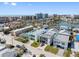 Aerial view of coastal homes with canal access, beach, and cityscape in the background at 120 148Th E Ave, Madeira Beach, FL 33708