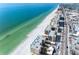 Stunning aerial view of a beachfront property with turquoise waters and white sandy beach at 120 148Th E Ave, Madeira Beach, FL 33708