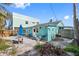 Backyard with patio, grill, outdoor seating and partially fenced area at 120 148Th E Ave, Madeira Beach, FL 33708