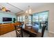 Elegant dining area with sliding glass doors to the outdoor patio, perfect for entertaining at 13452 Canopy Creek Dr, Tampa, FL 33625