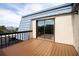 Balcony with blue roof, wood-look flooring, and sliding glass door at 14511 Catalina Cir # 14511, Seminole, FL 33776