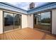 Balcony with wood-look flooring, blue roof and sliding glass door at 14511 Catalina Cir # 14511, Seminole, FL 33776
