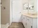 Bathroom featuring wood-look flooring, neutral tile in the shower, and a white vanity at 14511 Catalina Cir # 14511, Seminole, FL 33776