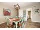 Charming dining area with rustic table, decor, and stylish lighting fixture, perfect for Gathering gatherings and casual dining at 14511 Catalina Cir # 14511, Seminole, FL 33776