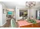 Well-lit dining room with sliding glass doors to the patio, seamlessly connecting indoor and outdoor spaces for relaxed living at 14511 Catalina Cir # 14511, Seminole, FL 33776