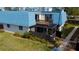 Charming townhome boasts blue roof, screened lanai, and a private balcony overlooking lush landscaping at 14511 Catalina Cir # 14511, Seminole, FL 33776