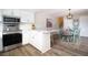 Stylish kitchen boasts modern appliances, granite counters, and an adjacent dining area at 14511 Catalina Cir # 14511, Seminole, FL 33776