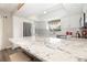 Well-lit kitchen featuring granite countertops, stainless steel appliances, and white cabinetry at 14511 Catalina Cir # 14511, Seminole, FL 33776
