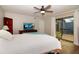 Cozy main bedroom with private balcony, modern ceiling fan, and scenic views providing a peaceful and stylish retreat at 14511 Catalina Cir # 14511, Seminole, FL 33776