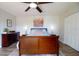 Bright main bedroom with stylish decor, featuring a comfortable bed, wood floors and ample natural light at 14511 Catalina Cir # 14511, Seminole, FL 33776