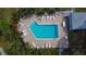Enjoy the lovely pool area surrounded by lush landscaping and plenty of seating at 14511 Catalina Cir # 14511, Seminole, FL 33776