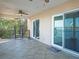 Outdoor terrace featuring tile flooring, spiral staircase, ceiling fan, and waterfront views at 148 93Rd Ave, Treasure Island, FL 33706