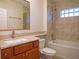 Updated bathroom features granite counters, vanity, and tiled tub/shower at 148 93Rd Ave, Treasure Island, FL 33706