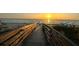 The boardwalk offers a picturesque pathway to the beautiful sandy beach at sunset at 1501 Howard Pl, Largo, FL 33770