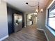 The kitchen offers stainless steel appliances, dark cabinets, and a dining area at 1501 Howard Pl, Largo, FL 33770