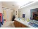 Bathroom featuring a shower/tub combination, a toilet, and a vanity sink at 15429 Green Jay Rd, Weeki Wachee, FL 34614