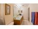 Bright bathroom with double sinks, vanity, and a framed mirror at 15429 Green Jay Rd, Weeki Wachee, FL 34614