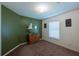 Bedroom features a large window and neutral decor at 15429 Green Jay Rd, Weeki Wachee, FL 34614