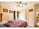 Bedroom featuring a ceiling fan, a closet with sliding doors, and neutral carpeting at 15429 Green Jay Rd, Weeki Wachee, FL 34614