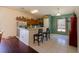 Bright kitchen with wood cabinets, stainless steel refrigerator, and breakfast bar at 15429 Green Jay Rd, Weeki Wachee, FL 34614