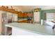 Kitchen featuring stainless steel appliances, breakfast bar and tile backsplash at 15429 Green Jay Rd, Weeki Wachee, FL 34614