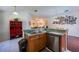 Cozy kitchen featuring stainless steel dishwasher and wood cabinets at 15429 Green Jay Rd, Weeki Wachee, FL 34614