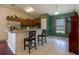 Eat-in kitchen with breakfast bar and stainless steel appliances at 15429 Green Jay Rd, Weeki Wachee, FL 34614