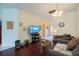 Inviting living room featuring hardwood floors and a cozy seating area at 15429 Green Jay Rd, Weeki Wachee, FL 34614