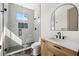 Modern bathroom featuring a glass shower, patterned tile floor and sleek vanity at 1802 E Park Cir, Tampa, FL 33610