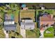 Aerial view of home showing fenced backyard with waterfront access and boat dock at 18350 Burkholder Cir, Port Charlotte, FL 33948