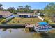 Waterfront property with a fenced yard, boat dock, and direct water access for boating and recreation at 18350 Burkholder Cir, Port Charlotte, FL 33948