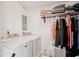 Well-organized laundry room with washer, dryer, and storage shelves, maximizing space at 18350 Burkholder Cir, Port Charlotte, FL 33948