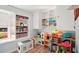 Playroom features toy shelves, toys, and wood floors at 18350 Burkholder Cir, Port Charlotte, FL 33948