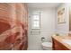 Tiled bathroom with granite countertop, patterned shower curtain and towel bar at 210 N Bayshore Blvd # 104, Clearwater, FL 33759